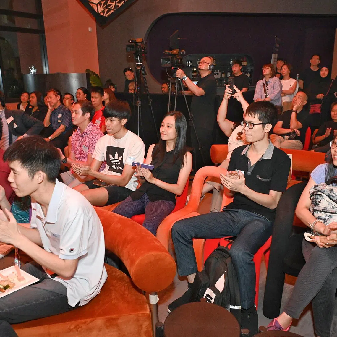 Attendees of the third edition of ST Podcasts Live which includes two podcast recordings on June 3, 2025 at 9 Raffles Place, Republic Plaza.