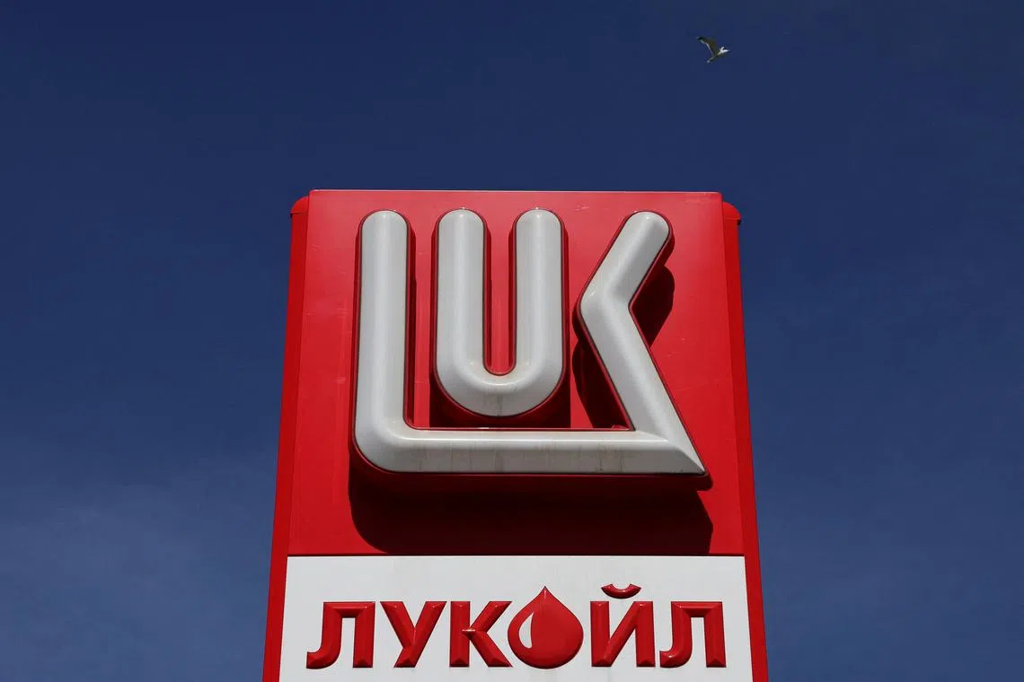 FILE PHOTO: The logo of Lukoil is on display at a petrol station in Saint Petersburg, Russia May 25, 2022. REUTERS/Anton Vaganov/File Photo