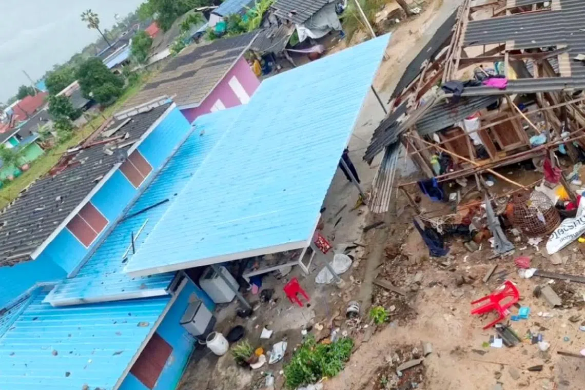 A massive waterspout ripped off roofs and advertising signs, which were blown into the air before crashing down on nearby homes.