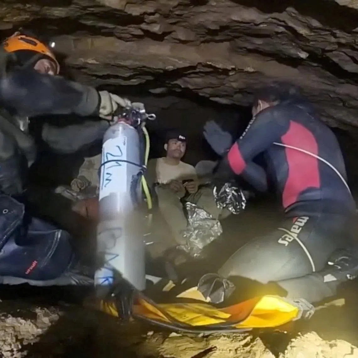 Rescue divers share the equipment usage guidelines with people trapped inside a cave during their rescue mission in Xaisomboun Province, Laos, in this screengrab obtained from a social media video released on May 30, 2026. Norrased Palasing/via REUTERS