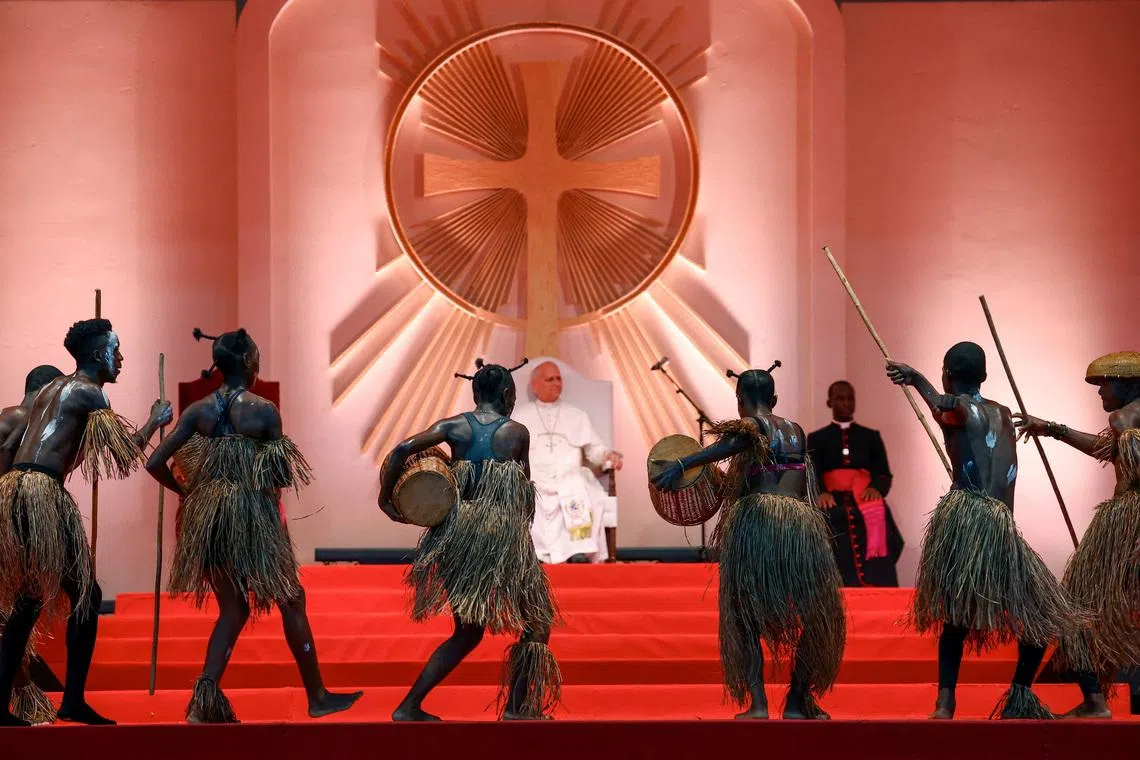 Performers dancing as Pope Leo XIV attends a meeting with young people and families at Bata Stadium, in Bata, Equatorial Guinea, April 22.