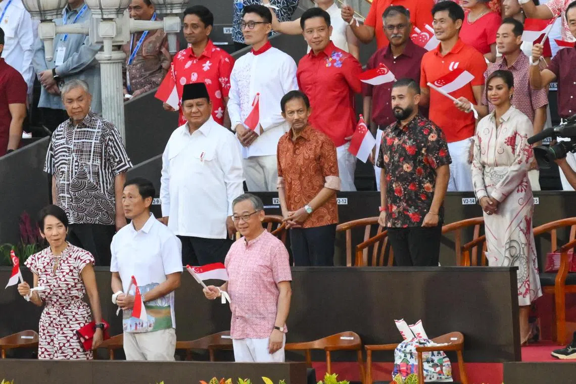 (L-R) Malaysia’s Minister of Rural and Regional Development Zahid Hamidi, Indonesian President Prabowo Subianto, Brunei’s Sultan Hassanal Bolkiah, Johor Crown Prince Tunku Ismail Ibrahim, and his wife, Che’ Puan Besar Khaleeda, attending Singapore’s 60th National Day Parade.