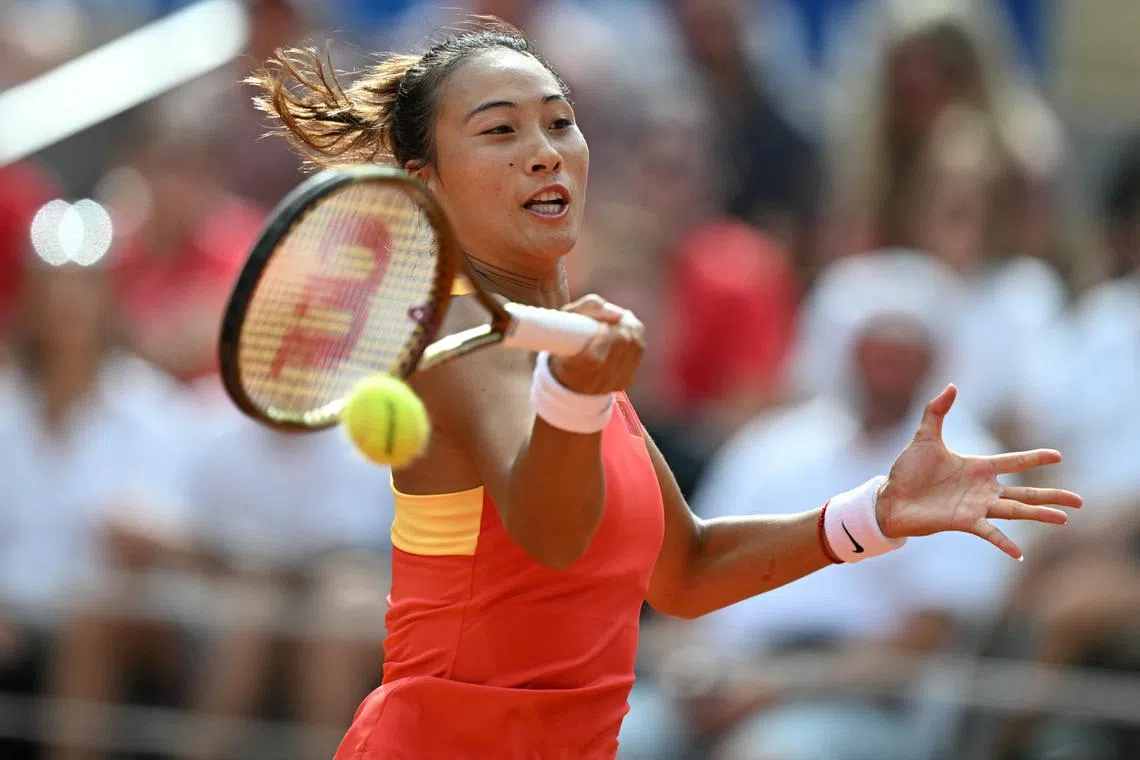 China's Zheng Qinwen returns to Croatia's Donna Vekic during their women's singles final at the Paris Olympics.