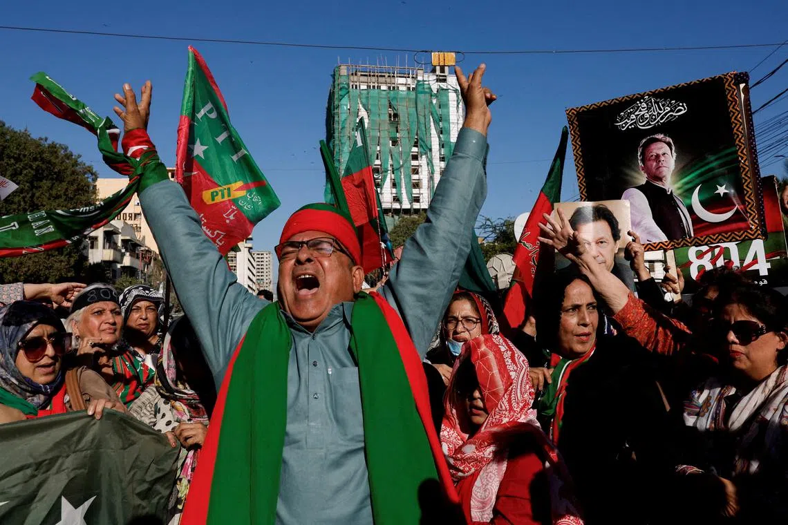 FILE PHOTO: Supporters of former Prime Minister Imran Khan's party, the Pakistan Tehreek-e-Insaf (PTI), chant slogans as they gather during a protest demanding free and fair results of the elections, outside the provincial election commission office in Karachi, Pakistan February 17, 2024. REUTERS/Akhtar Soomro/File Photo