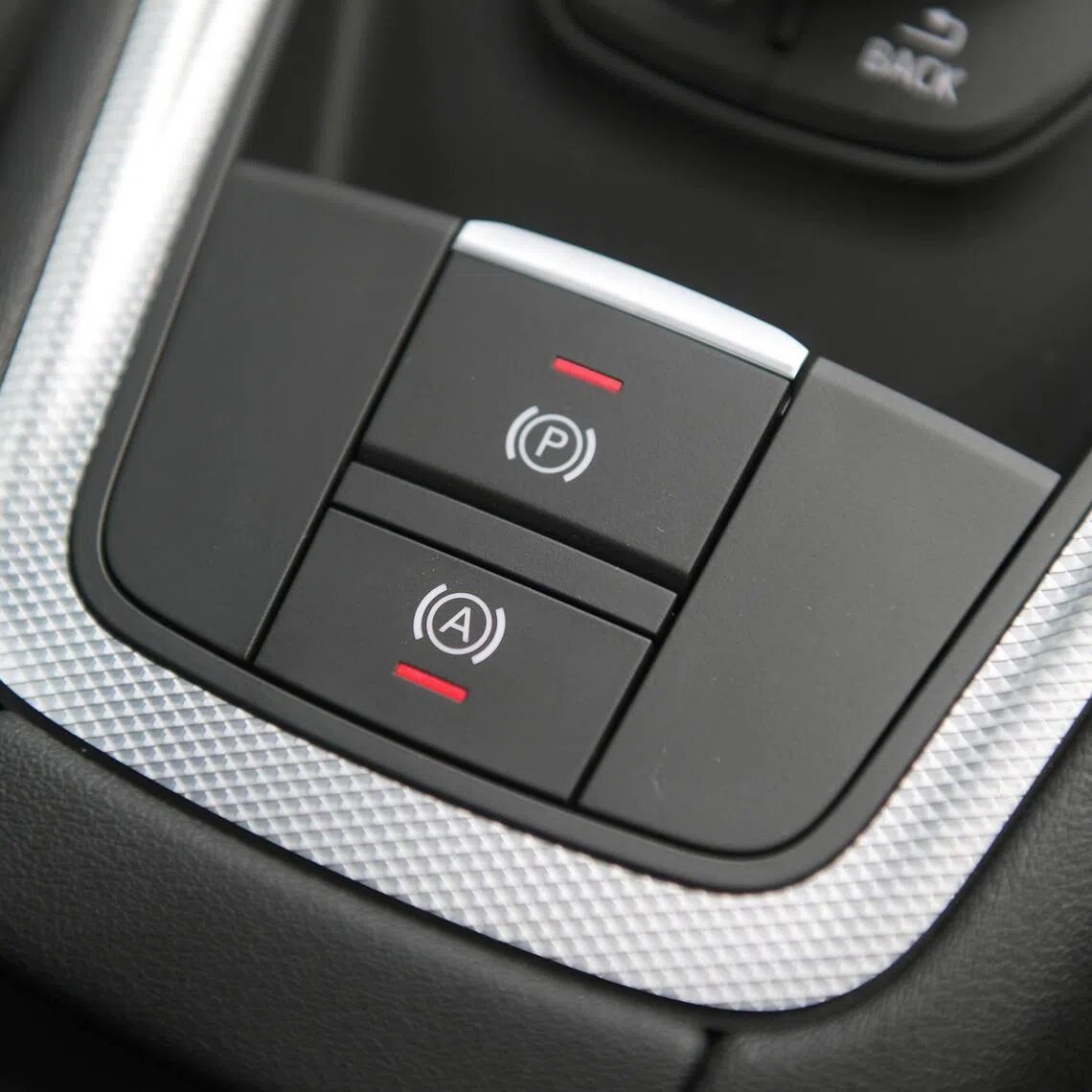 Pulling the EPB button tells the electric motor to lock the brake disc or drum, preventing the car from rolling away. 