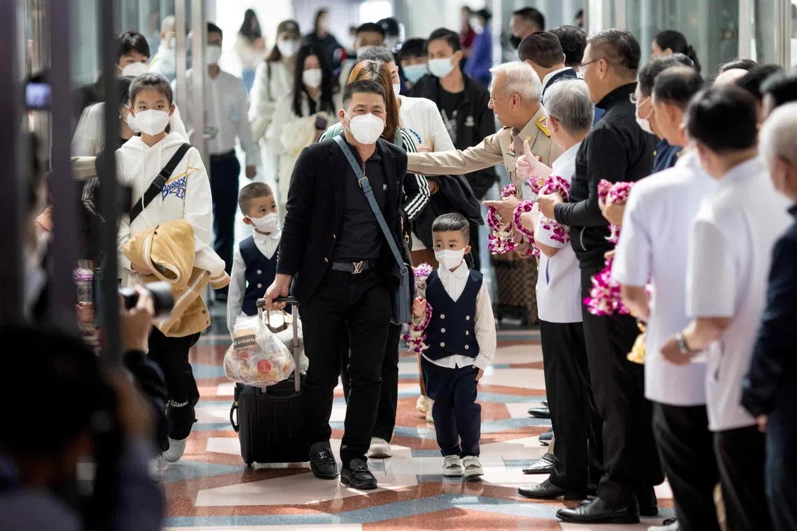 In this file photo, travellers from a Xiamen Airlines flight are greeted by Thai health and government officials as they arrive at Suvarnabhumi Airport in Bangkok on Jan 9, 2023, as China removed Covid-19 travel restrictions. 
