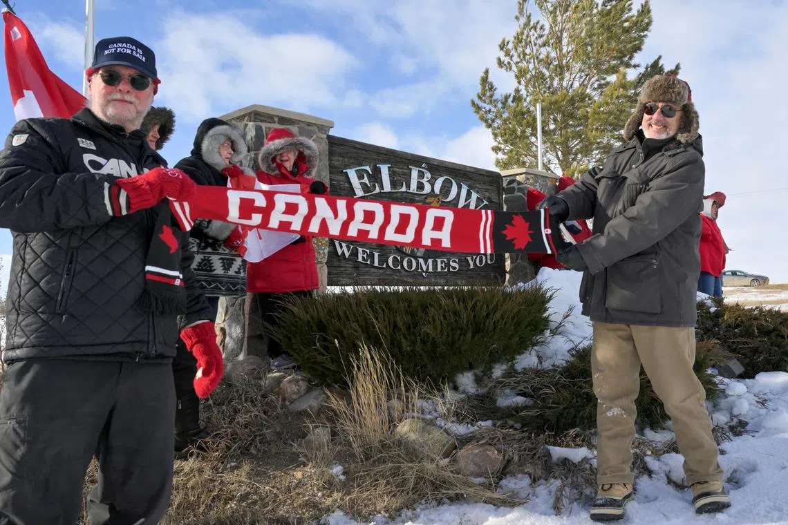 People take part in a \"Elbows up\" rally amid rising Canada-U.S. tensions on the back of tariffs imposed by U.S. President Donald Trump, in Elbow, Saskatchewan, Canada, March 14, 2025. REUTERS/Nayan Sthankiya