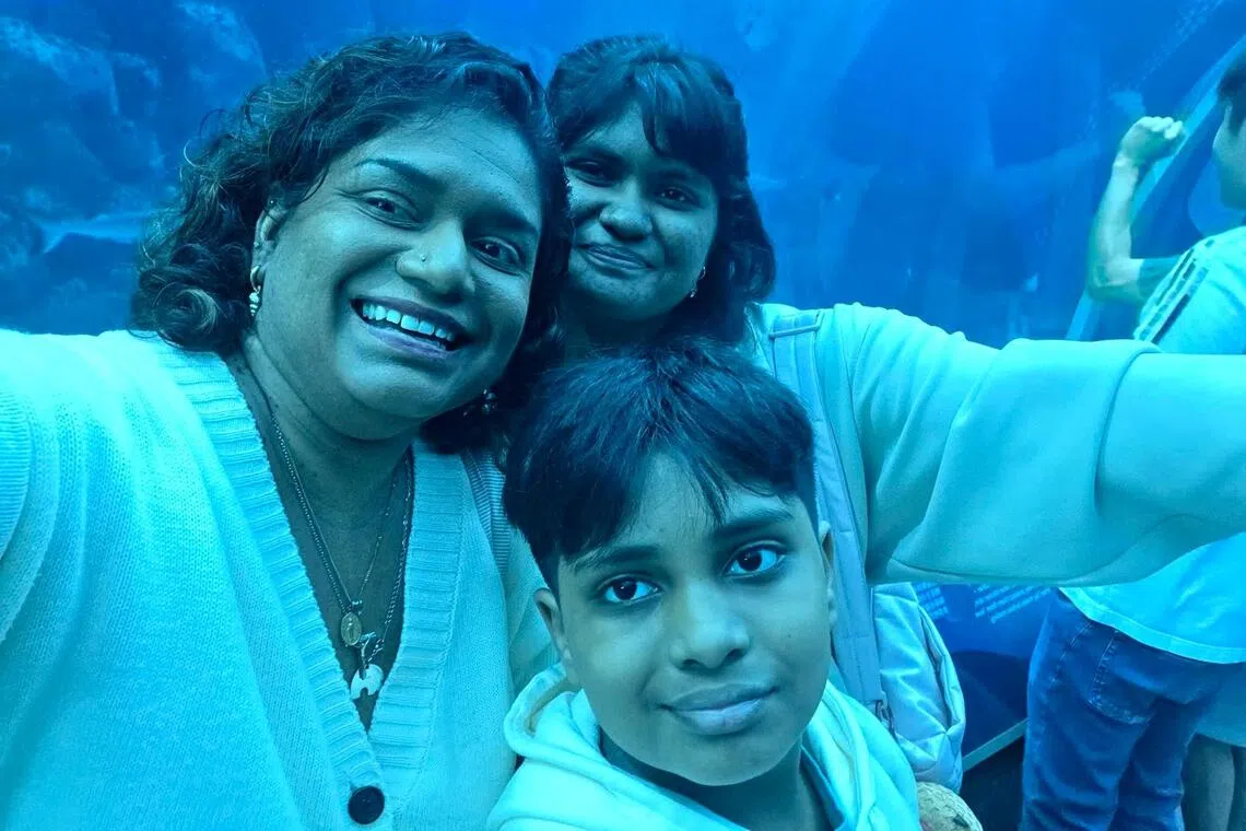 Mother-of-two Shoba Agnetha Seetaram at the Singapore Oceanarium with her 17-year-old daughter and 12-year-old son.