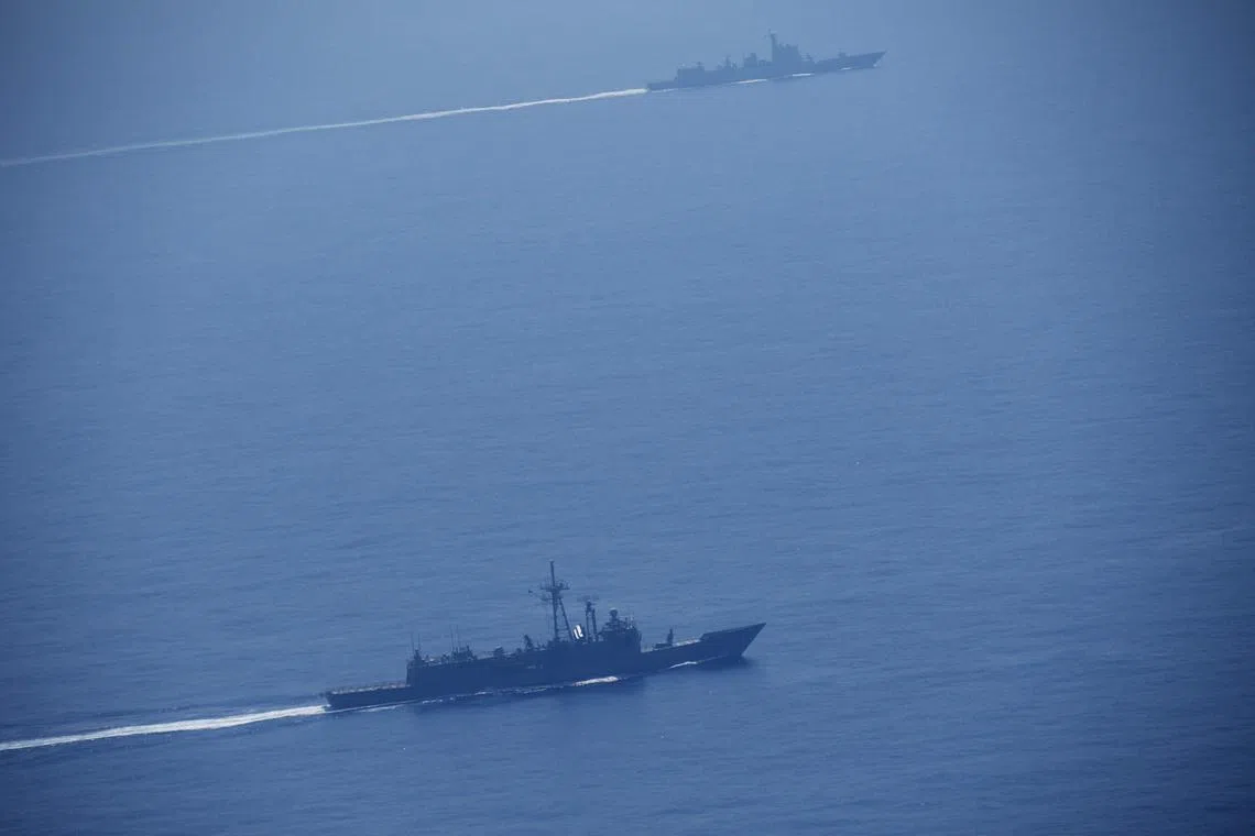 This handout photo shows Chinese military vessels sailing in an unknown location during war games off the coast of Taiwan.