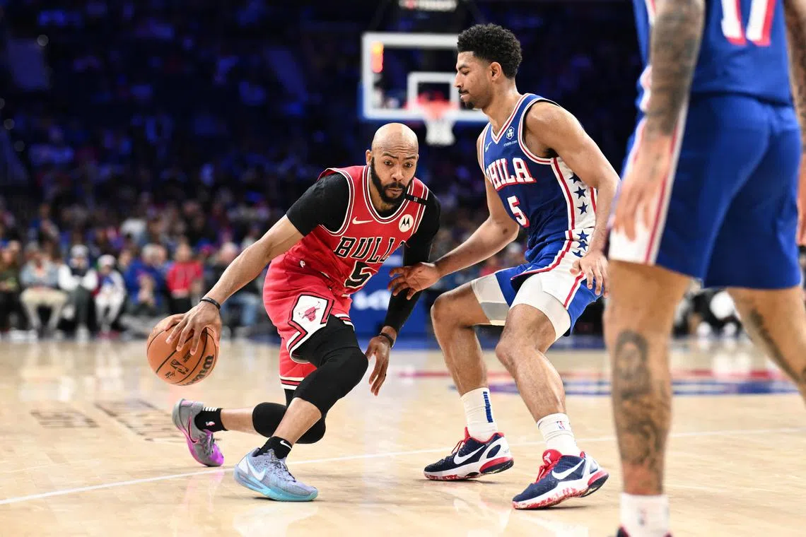 Chicago Bulls guard Jevon Carter drives against Philadelphia 76ers guard Quentin Grimes in the fourth quarter at Wells Fargo Centre.