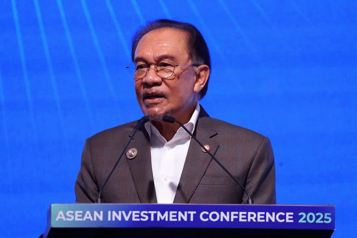 FILE PHOTO: Malaysian Prime Minister Anwar Ibrahim delivers his speech as he officates the ASEAN Investement Conference in Kuala Lumpur, Malaysia April 8, 2025. REUTERS/Hasnoor Hussain/File Photo