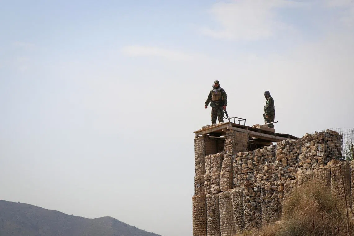 Taliban soldiers stand on top of a their post as they guard near the Pakistan-Afghanistan border, in Khost province, Afghanistan, February 27, 2026. REUTERS/Stringer