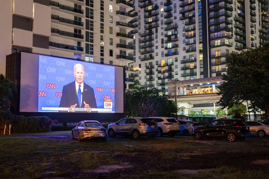 Vehicles in front of a screen during a debate watch party at the Nite Owl Drive-In theater in Miami, on June 27.