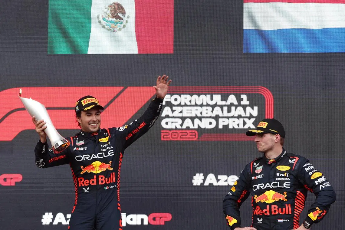 Red Bull's Sergio Perez (left) celebrares on the podium next to his teammate Max Verstappen after he won the Azerbaijan race.