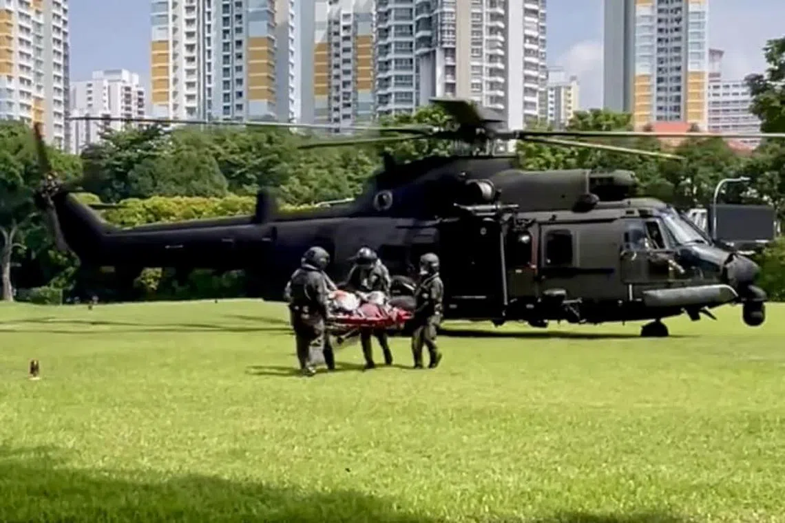 RSAF's H225M Medium Lift Helicopter arriving at the Singapore General Hospital with the two injured crewmen.
