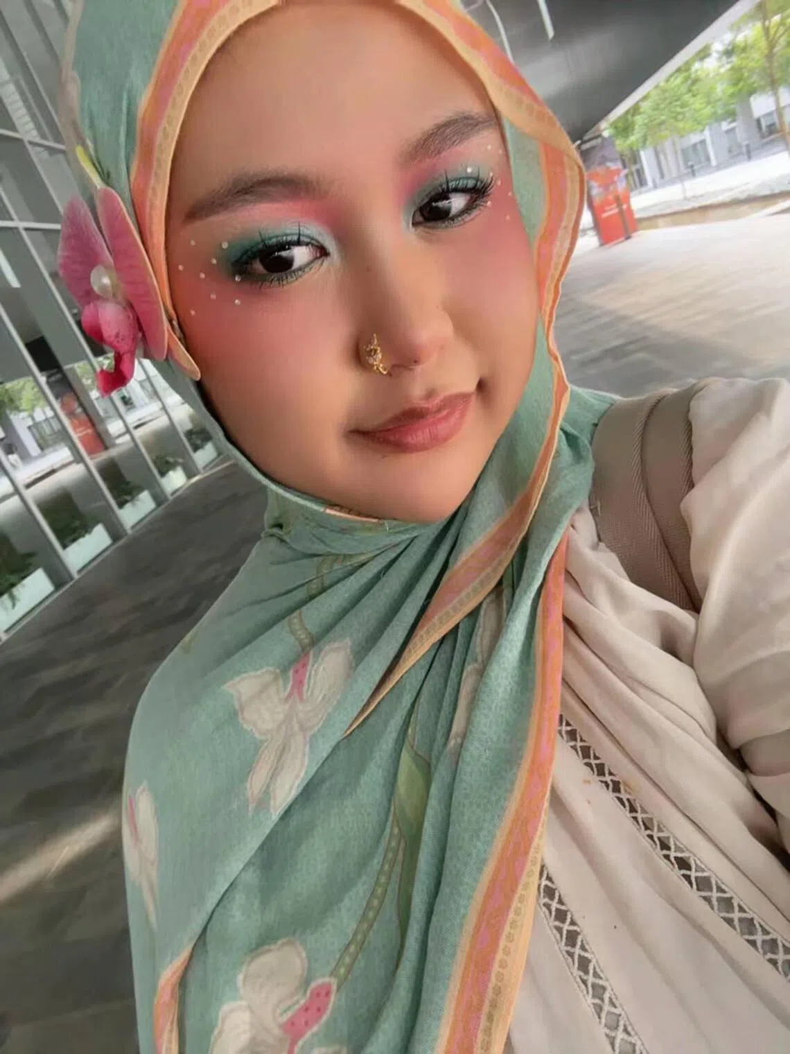 Hadhirah Insyirah Binte Alfie Fadzil’s make-up look with gem stones.