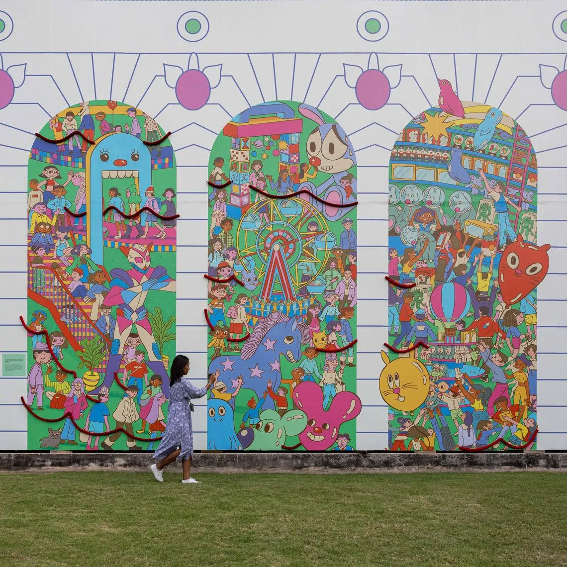 The three-panel mural shows the developing narrative of people starting to queue for toys and those already clamouring for their finds.