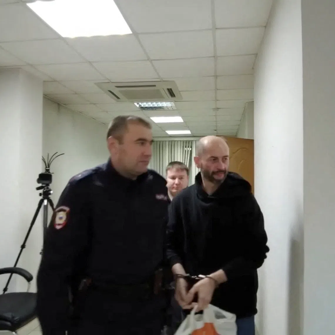 Belarusian citizen Sergei Yeremeyev, who is accused of carrying out an act of terrorism and of planting explosives on two freight trains in Russia's Buryatia region on the orders of Ukraine's intelligence services in 2023, attends a court hearing in Chita, Russia, in this still image from video released December 18, 2025. Russian Prosecutor General's Office/Handout via REUTERS
