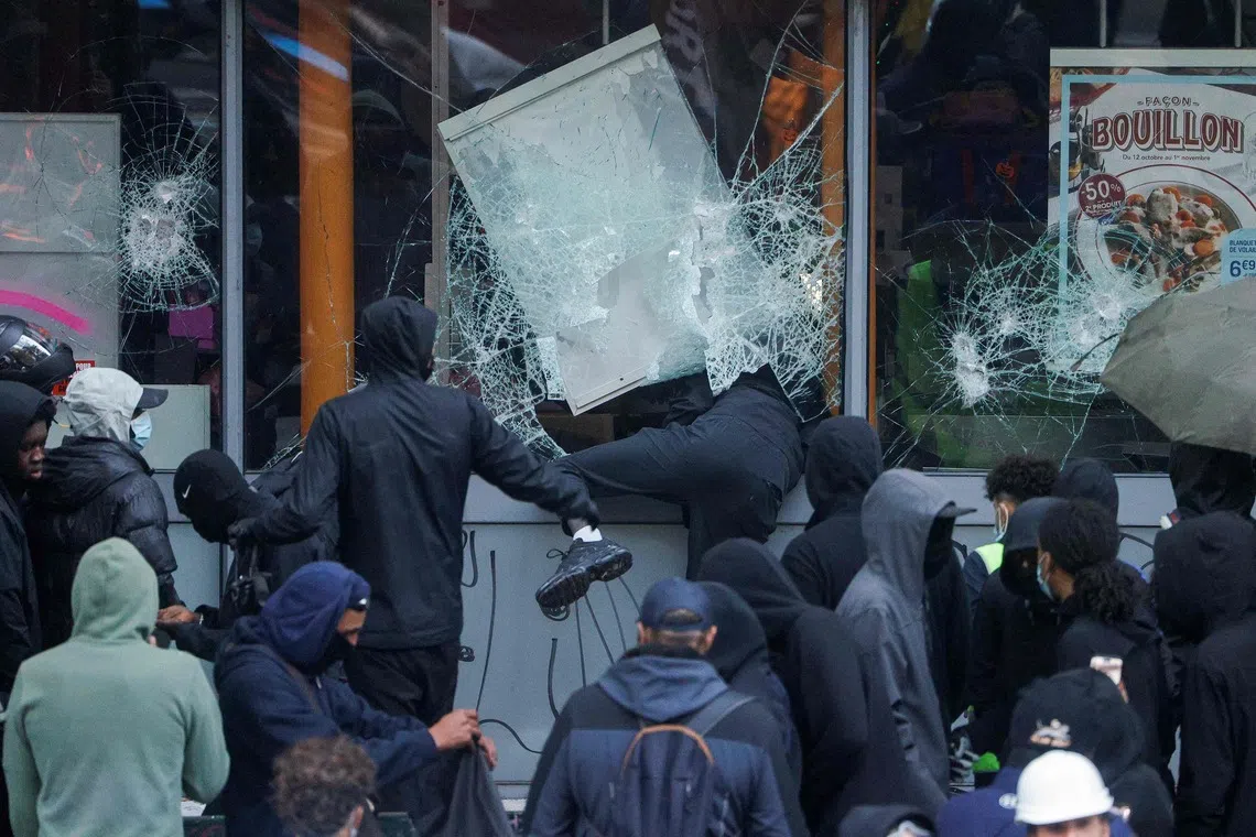 Protesters break windows of a French food company 'Picard' shop during a demonstration in Paris on Oct 17, 2026.
