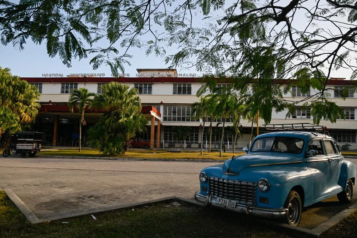 A vintage car is parked outside the Provincial Clinical–Surgical Hospital \"Arnaldo Milian Castro,\" where, according to local information, injured people were being treated after an armed incident involving a Florida-registered speedboat and a Cuban patrol, at a time of heightened tensions with the U.S., in Santa Clara, Cuba, February 26, 2026. REUTERS/Norlys Perez