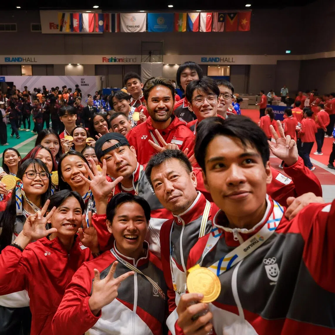 Singapore fencer Simon Lee Renjie (front) and the fencing team taking a group picture after the end of the medal ceremony at Fashion Island Shopping Mall during the Thailand SEA Games in Bangkok on Dec 19, 2025.