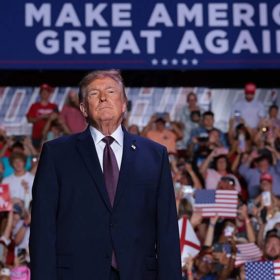 US President Donald Trump taking to the stage at a Republican campaign rally in Mobile, Alabama, on Oct 2. An enthusiasm gap among voters is favouring the Democrats in the US midterm elections.