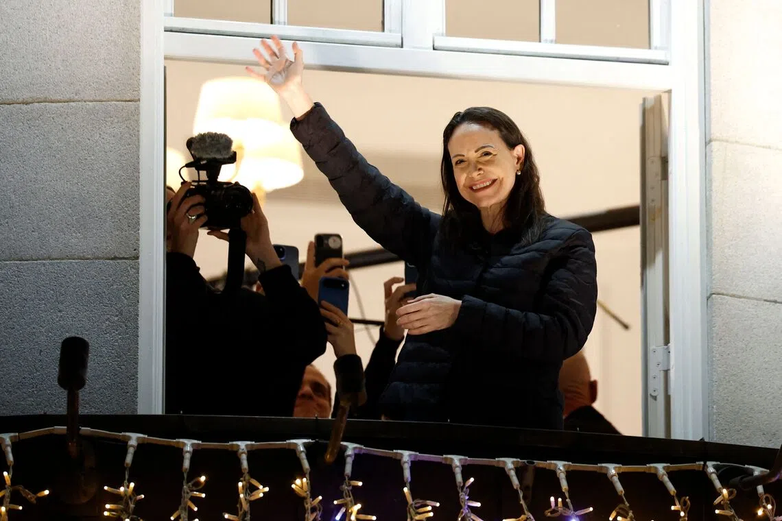 Nobel Peace Prize laureate Maria Corina Machado greets supporters from a balcony of the Grand Hotel in Oslo, Norway, on Dec 11.