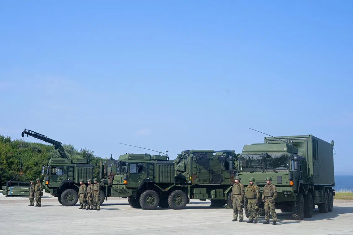 FILE PHOTO: Soldiers stand next to the IRIS-T SLM air defence system at the German army Bundeswehr barracks Todendorf in Panker, Germany September 4, 2024. REUTERS/Fabian Bimmer/File Photo