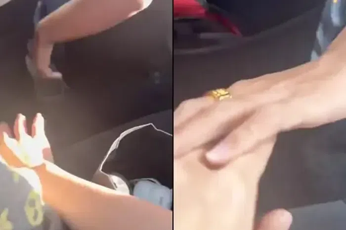 The passenger used her hand to protect herself from the driver’s grasp and then used the same hand to grip her clothing and did not respond.