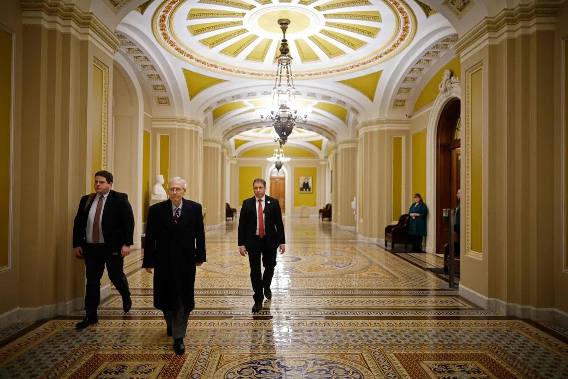 WASHINGTON, DC - FEBRUARY 12: Senate Minority Leader Mitch McConnell (R-KY) (2L) leaves his office following a series of votes at the U.S. Capitol on February 12, 2024 in Washington, DC. Following a series of evening votes, the Senate will stay in session all night with the goal of passing national security legislation that would send $95 billion in military aid to Ukraine, Israel and Taiwan.   Chip Somodevilla/Getty Images/AFP (Photo by CHIP SOMODEVILLA / GETTY IMAGES NORTH AMERICA / Getty Images via AFP)