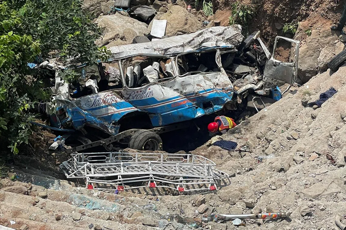 Twelve people are missing after a bus carrying 27 passengers - members of a wedding party - fell into the Indus river in northern Pakistan.