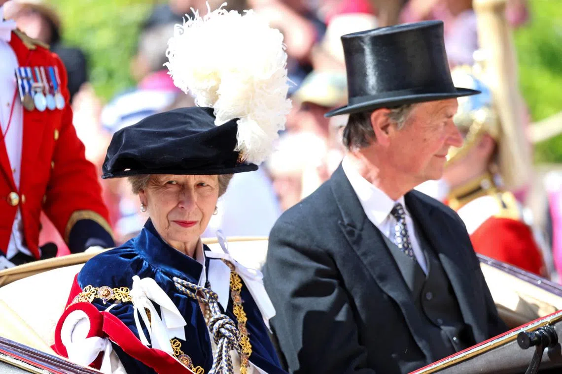 (FILES) Britain's Princess Anne, Princess Royal (L) and Vice Admiral Timothy Laurence leave by carriage after attending the Order of the Garter service, at St George's Chapel, at Windsor Castle, in Windsor, southern England, on June 17, 2024. Buckingham Palace said in a statement on June 24, that Princess Anne sustained minor injuries and concussion following an incident on June 23 at the Gatcombe Park estate yesterday evening. Her Royal Highness remains in hospital, as a precautionary measure for observation and is expected to make a full and swift recovery. (Photo by Chris Jackson / POOL / AFP)