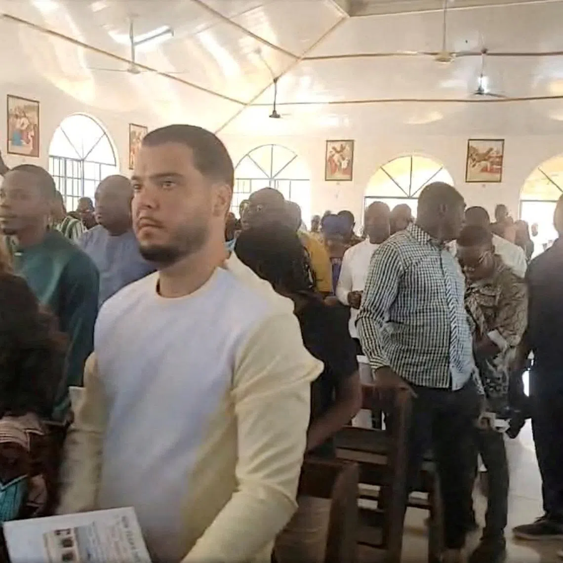 FILE PHOTO: Convicted cocaine smuggler Jos Leijdekkers attends a church service in Tihun, Sierra Leone, January 1, 2025, in this screen grab obtained from a social media video. First Lady Fatima Maada Bio via Facebook/via REUTERS/File Photo