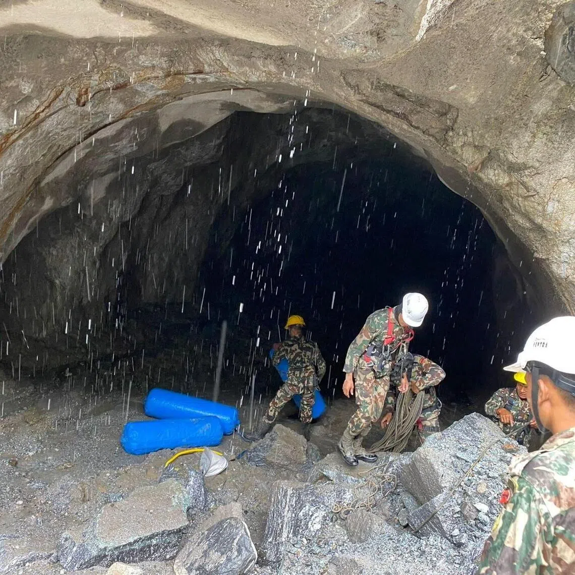Soldiers working during a search-and-rescue operation at a tunnel near a hydropower project site in Rasuwa, Nepal, on Sept 2.