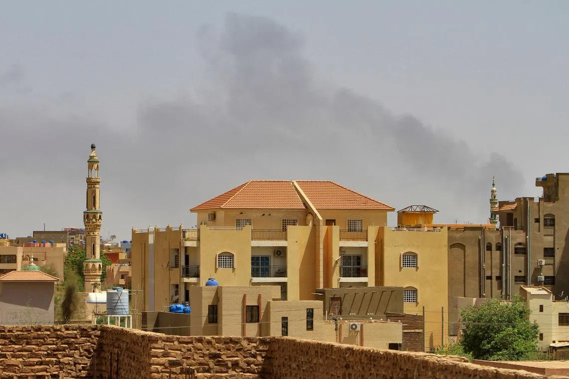 Smoke rising above buildings in Khartoum, amid continual fighting, on May 12, 2023.