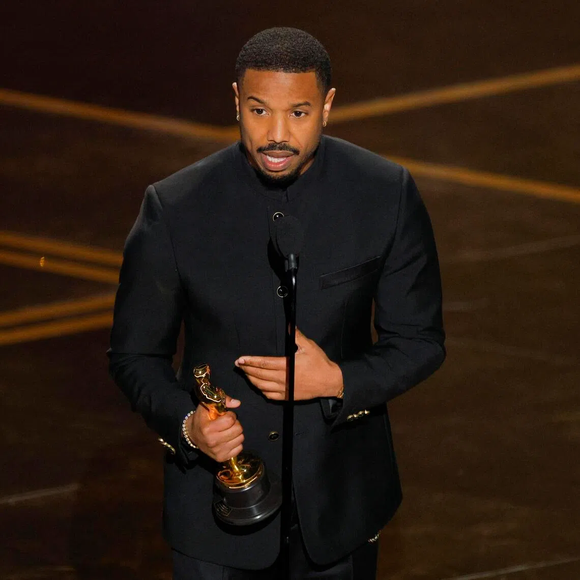 Michael B. Jordan accepts the Oscar for Best Actor for Sinners during the Oscars show at the 98th Academy Awards on March 15.