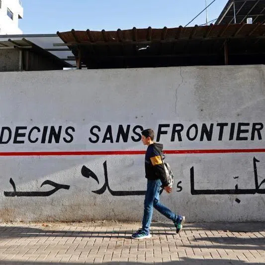 A Palestinian boy walks past the clinic of Doctors Without Borders or Medecins Sans Frontieres (MSF), in the al-Rimal neighbourhood of Gaza City.