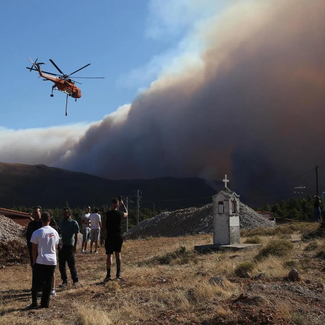 Investigators believe the blaze started with a spark from power cables managed by a private company near Agios Vasileios.