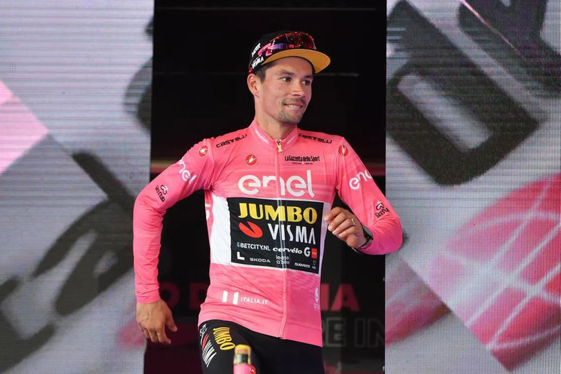 FILE PHOTO: Cycling - Giro d'Italia - Stage 21 - Rome to Rome - Italy - May 28, 2023 Jumbo – Visma's Primoz Roglic celebrates on the podium after winning the Giro d'Italia REUTERS/Jennifer Lorenzini/File Photo
