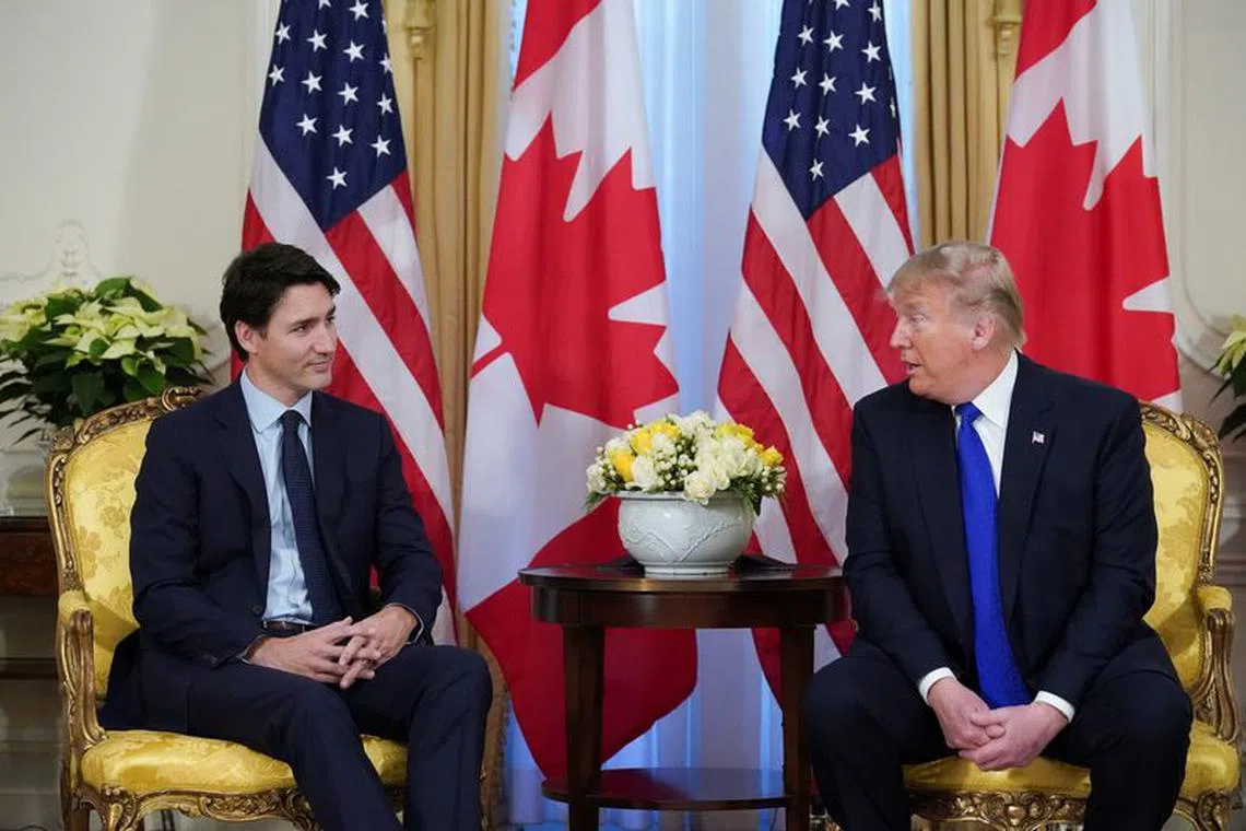 U.S. President Donald Trump and Canada's Prime Minister Justin Trudeau hold a meeting ahead of the NATO summit in Watford, in London, Britain, December 3, 2019. REUTERS/Kevin Lamarque/ File Photo