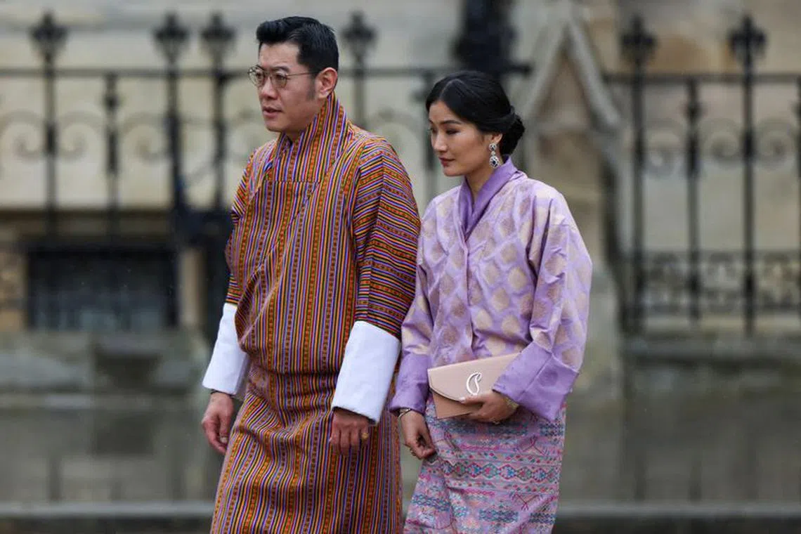 FILE PHOTO: Bhutan's King Jigme Khesar Namgyel Wangchuck and Queen Jetsun Pema arrive to attend Britain's King Charles and Queen Camilla's coronation ceremony at Westminster Abbey, in London, Britain May 6, 2023. REUTERS/Henry Nicholls/File Photo