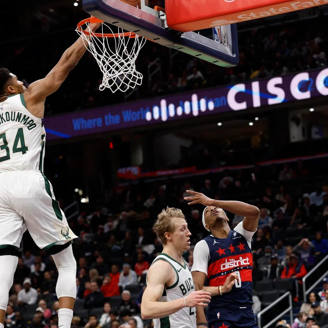 Milwaukee Bucks forward Giannis Antetokounmpo blocks the shot of Washington Wizards guard Bilal Coulibaly in the second half at Capital One Arena.