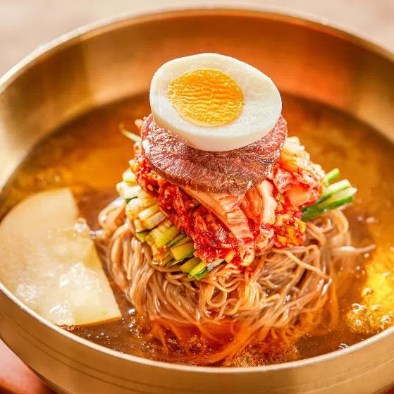 (Clockwise from top left) Cold buckwheat noodles from  Xita Lao Tai Tai, Chuan Bistro at Chijmes, the buffet spread at JING Hotpot and Grill and Mr Jonathan Ng, Chagee’s APAC director for government and public affairs.