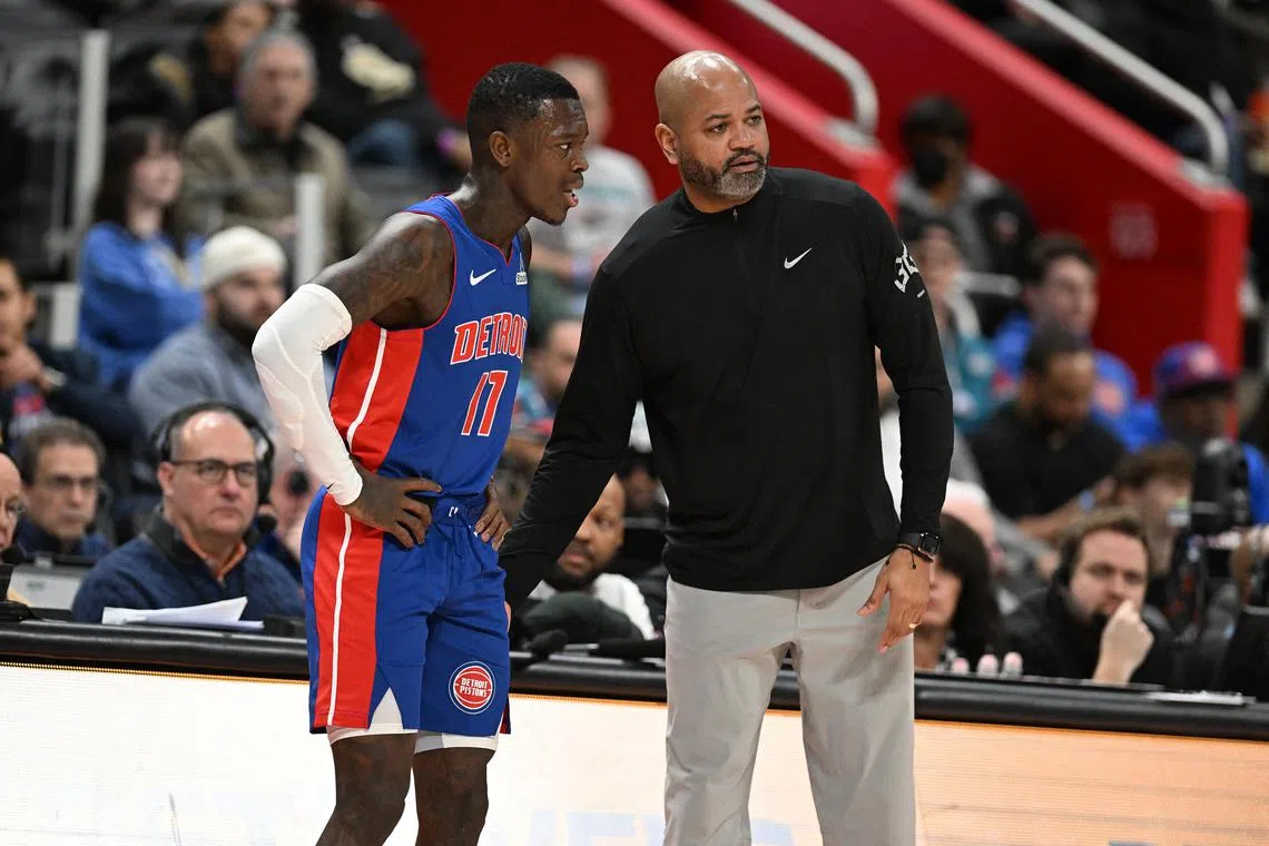 Detroit Pistons' newly acquired guard, Dennis Schroder, speaking to head coach J.B. Bickerstaff in the second quarter of their game against the Charlotte Hornets at Little Caesars Arena.