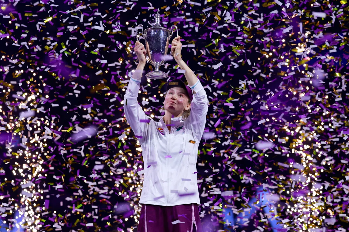 Tennis - WTA Finals - Riyadh - King Saud University Indoor Arena, Riyadh, Saudi Arabia - November 8, 2025 Kazakhstan's Elena Rybakina celebrates with the trophy after winning the final match against Belarus' Aryna Sabalenka REUTERS/Stephanie Lecocq