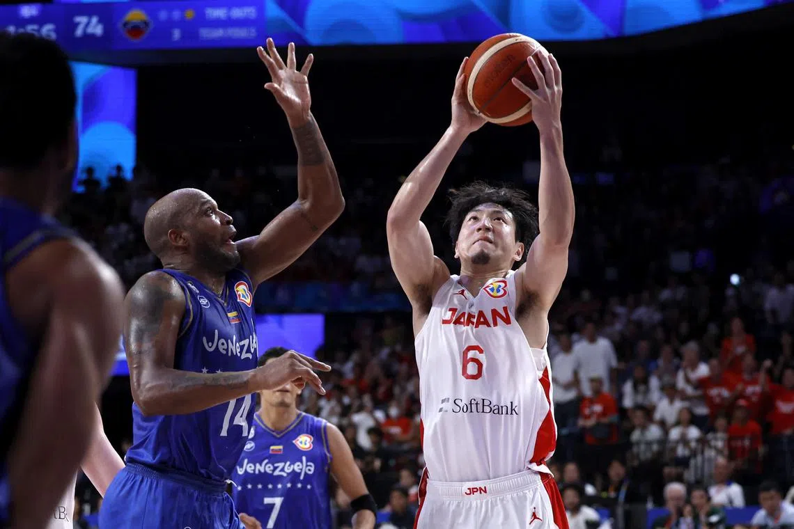 Japan's Makoto Hiejima scoring a basket in the team's 86-77 win against Venezuela in the basketball World Cup.