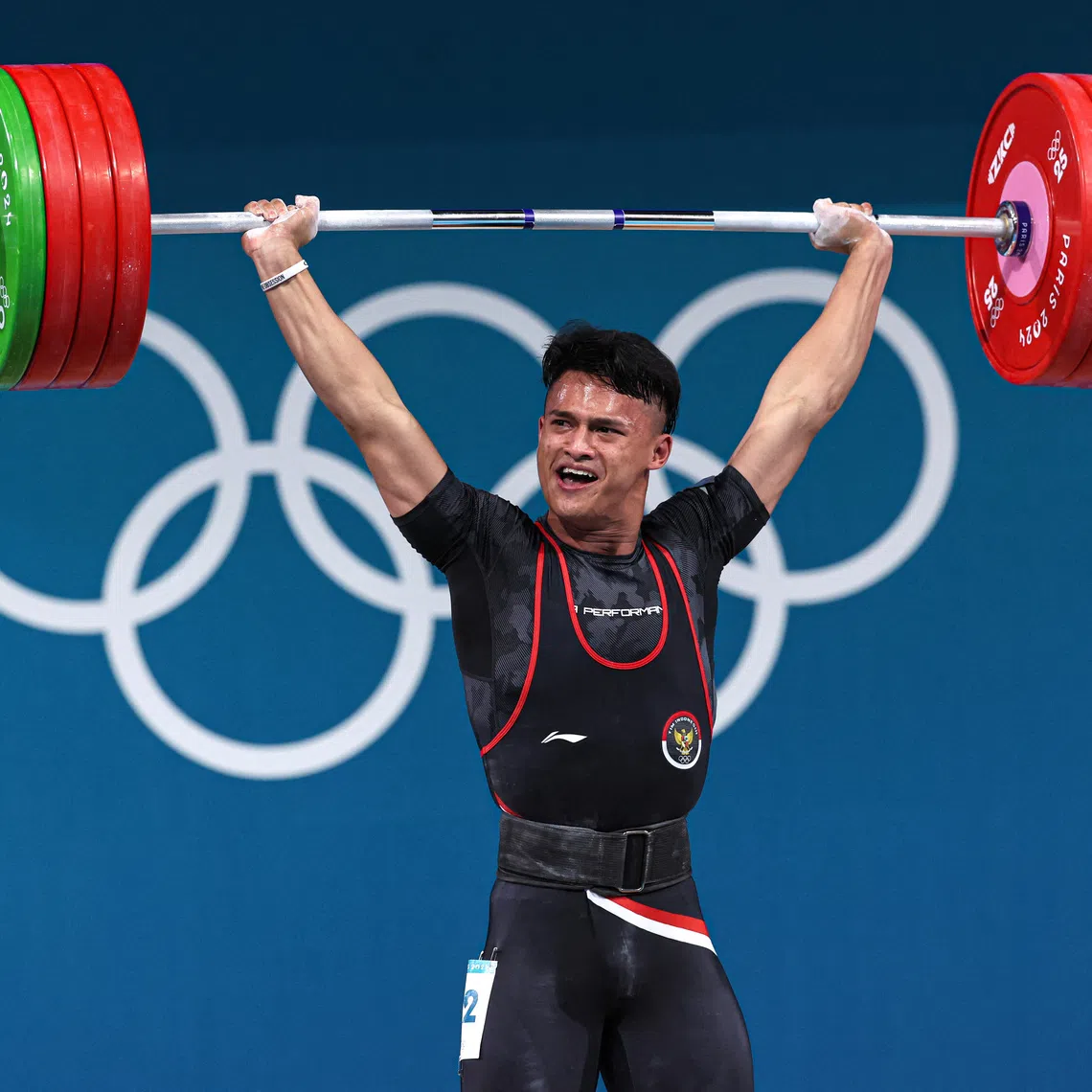 Paris 2024 Olympics - Weightlifting - Men's 73kg - South Paris Arena 6, Paris, France - August 08, 2024. Rizki Juniansyah of Indonesia in action. REUTERS/Amanda Perobelli