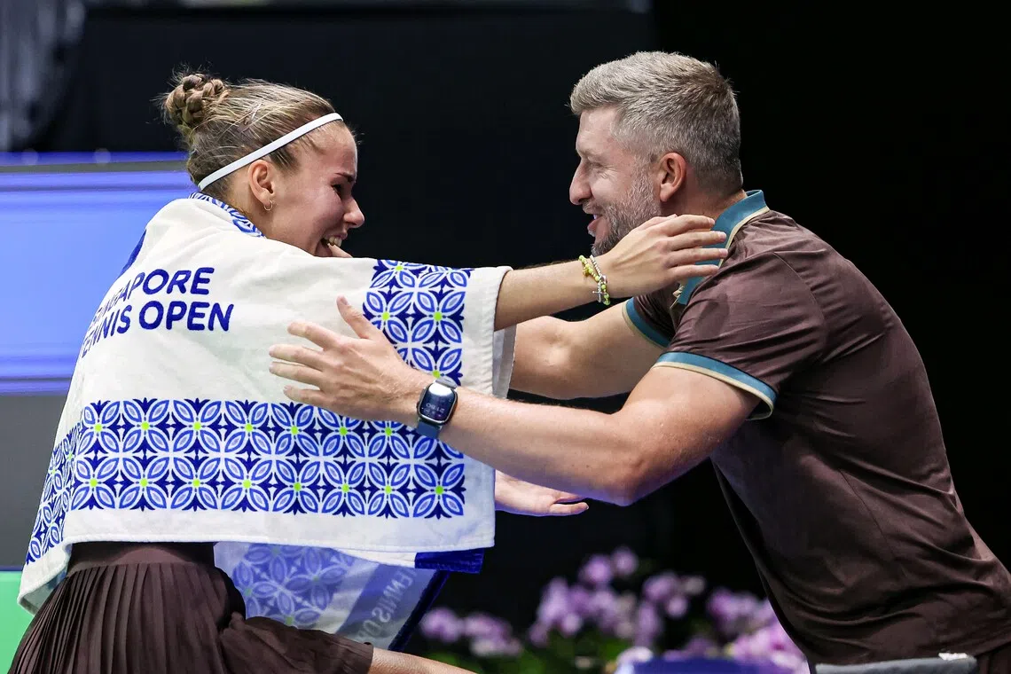Tatiana Prozorova hugging her husband and coach Alexander Prozorov after winning against Alexandra Eala at the Singapore Tennis Open on Sept 24.