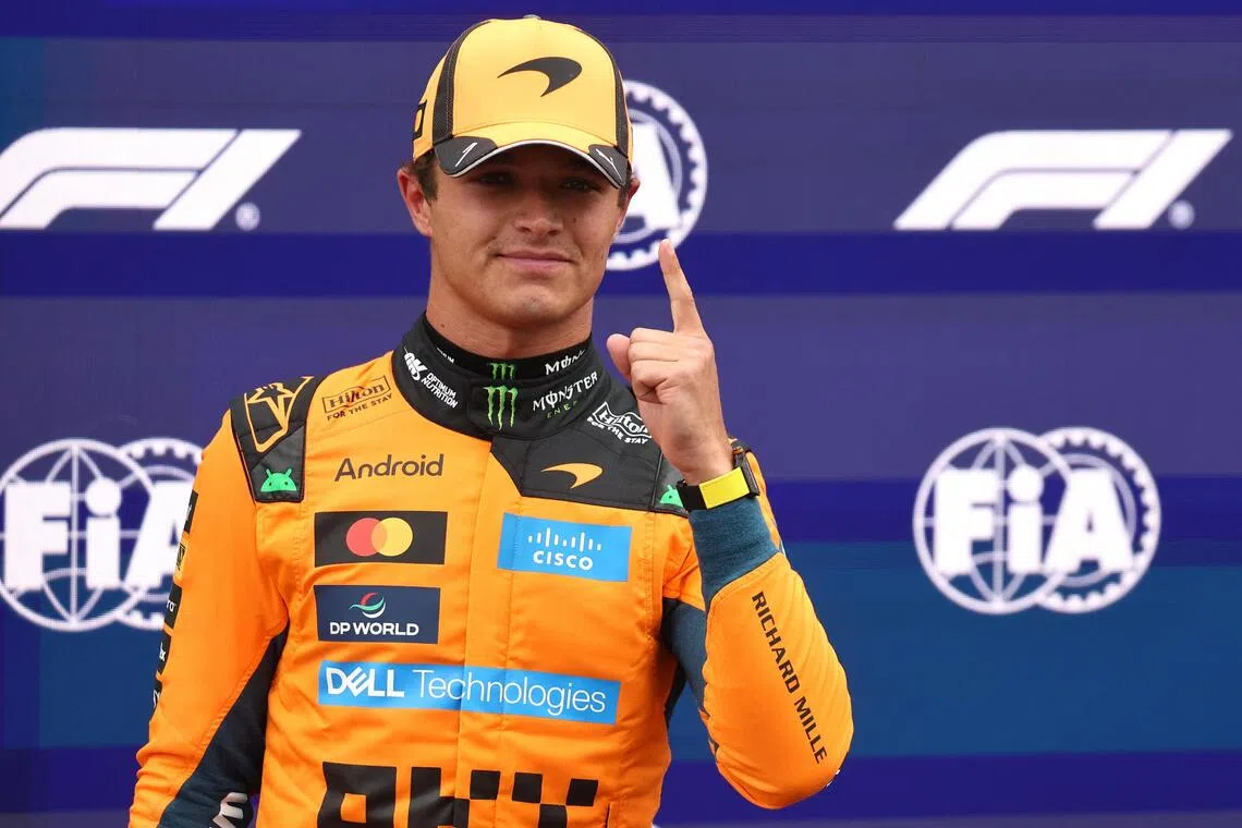 McLaren’s Lando Norris celebrates after qualifying in pole position on Aug 22 for the Dutch grand prix.