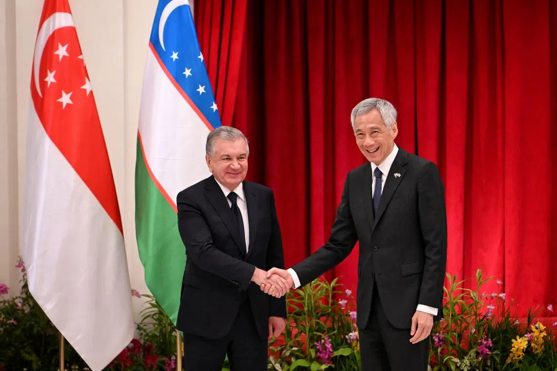Prime Minister Lee Hsien Loong and Uzbek President Shavkat Mirziyoyev witnessed the exchange of the pacts at the Istana.